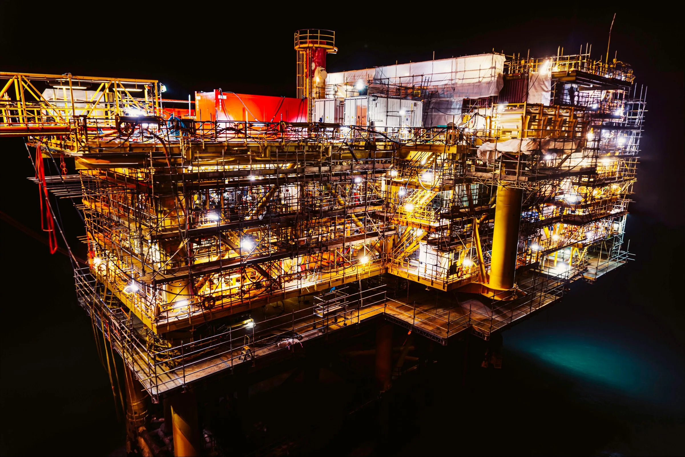 Production platform lit at night